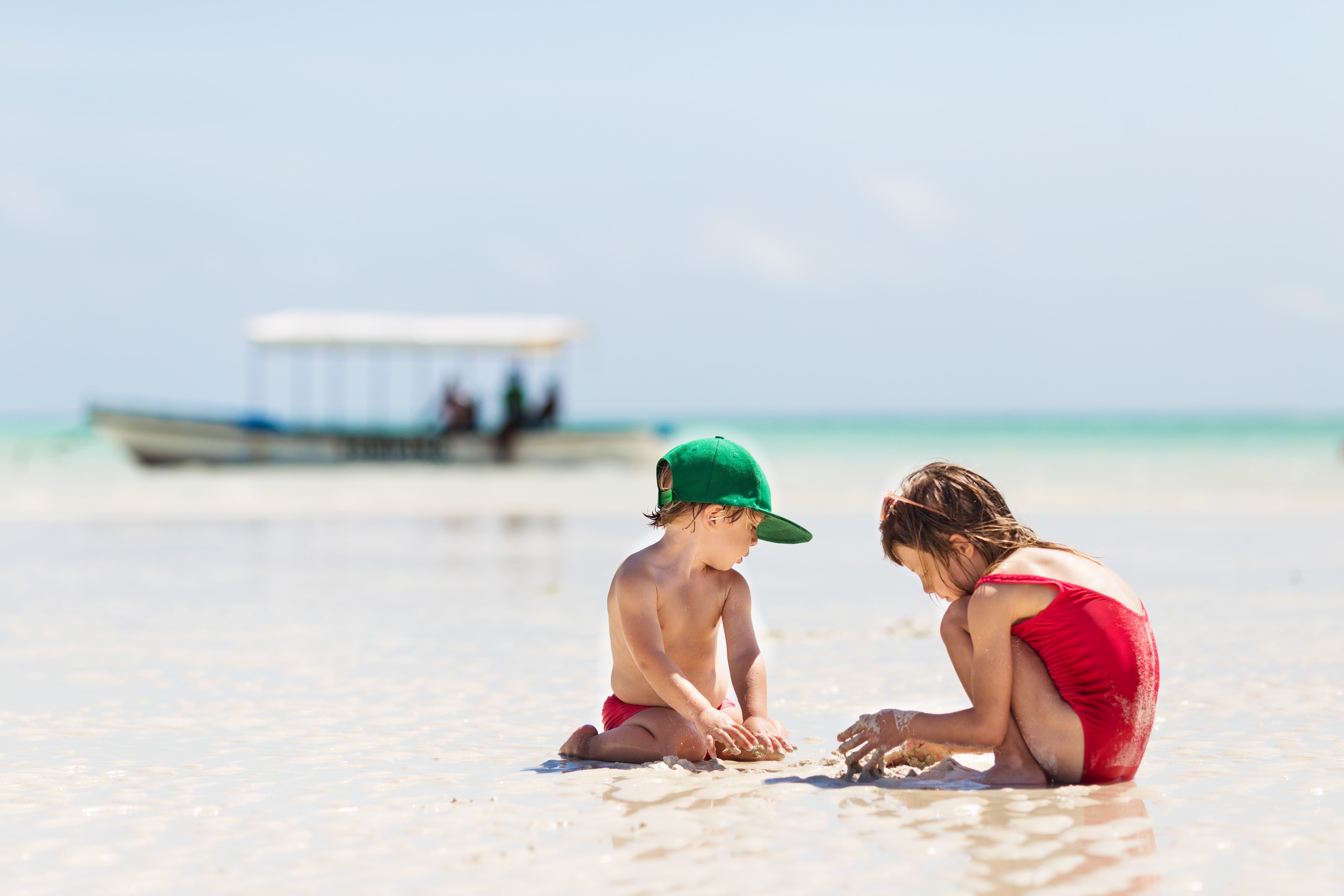 Children playing at the water’s edge, Zanzibar