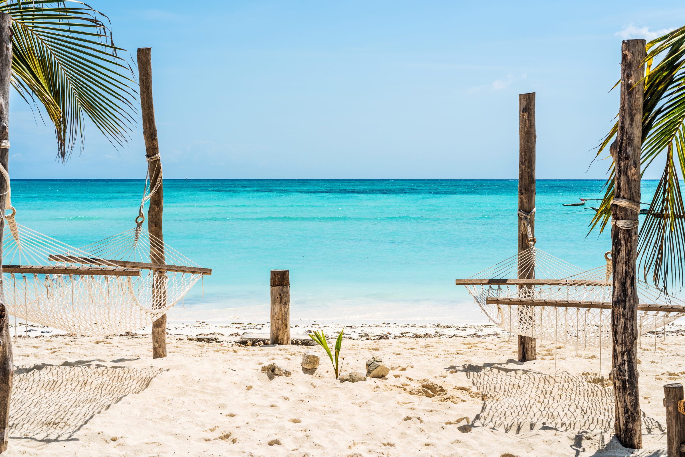 Zanzibar coastline with turquoise shallows beside a managed beachside residence